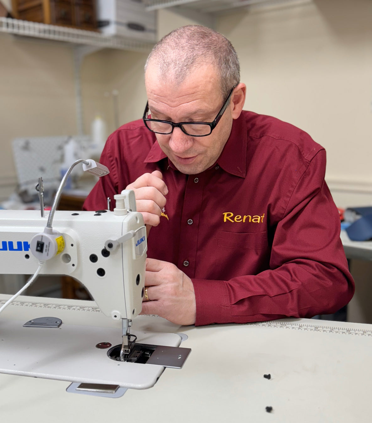 Renato servicing JUKI 8700 from back